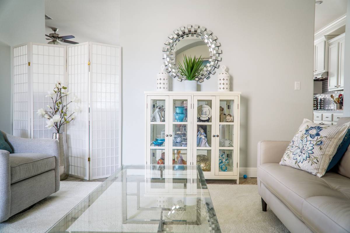 Modular storage units for home use in a real-world entryway setup showing adjustable shelves and labeled bins