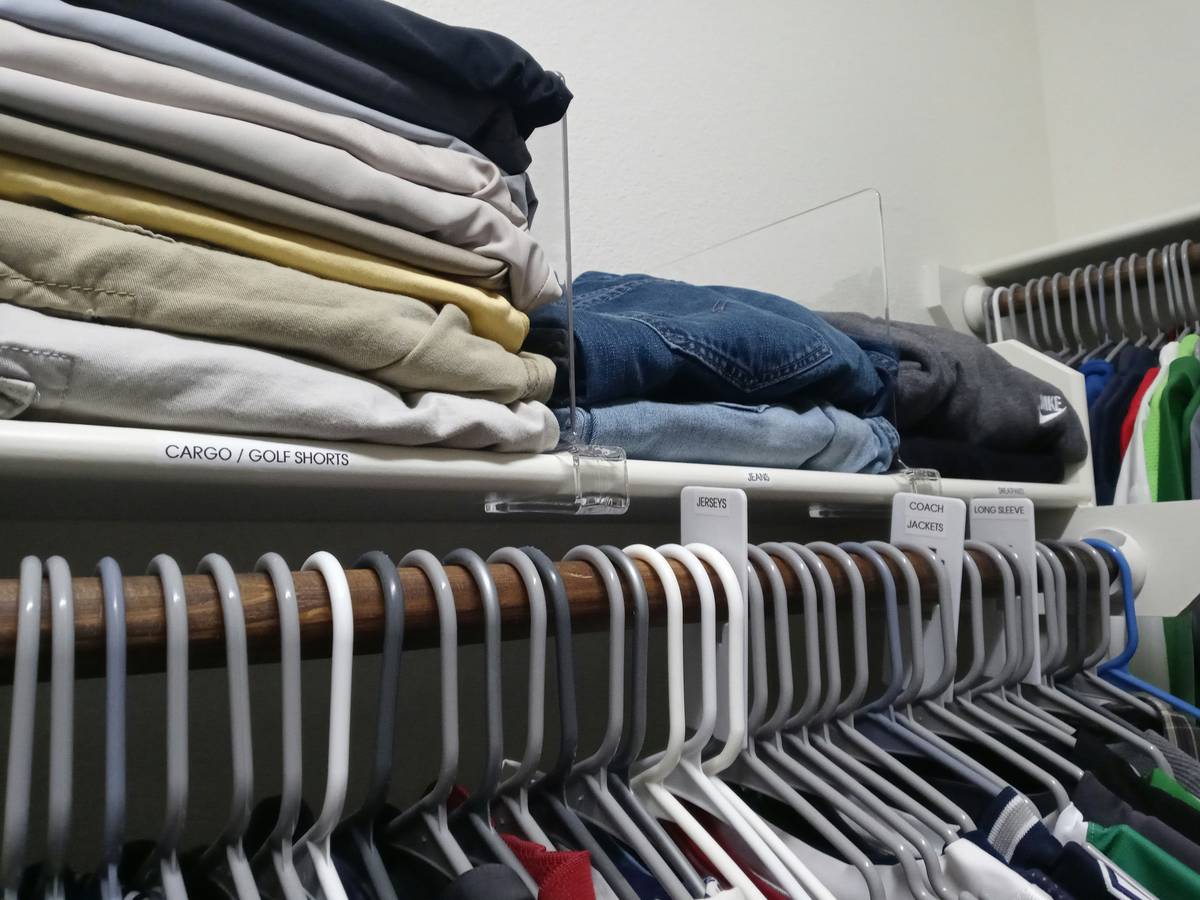 home organization storage unit how to: labeled clear bins stacked vertically in a closet with adjustable shelves